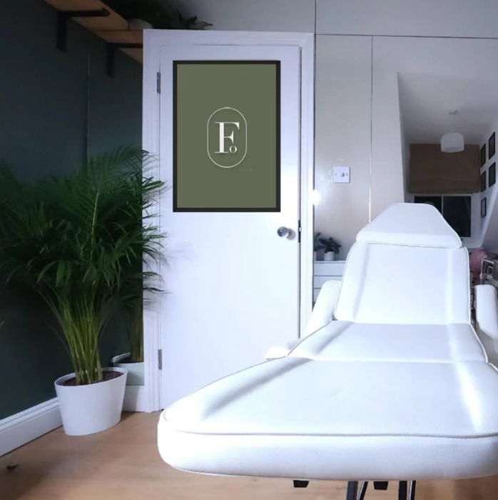 A white chair with the letter f on it