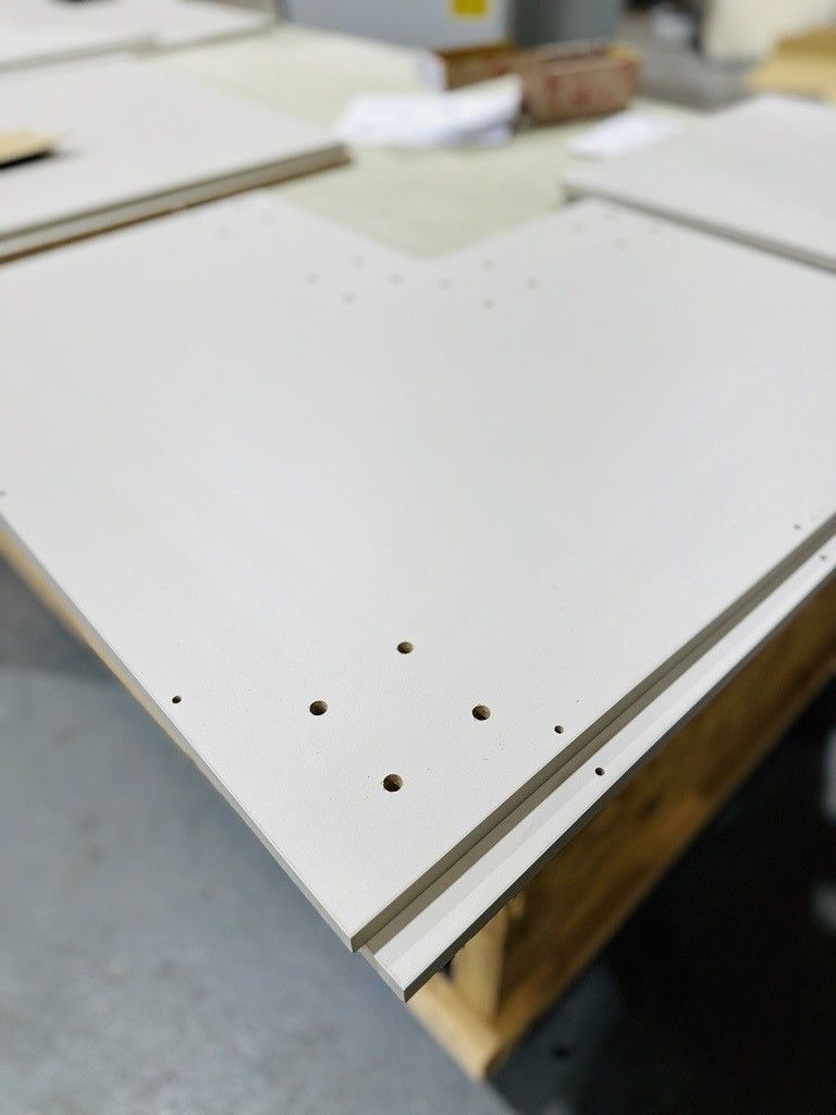 White drilled and edged board