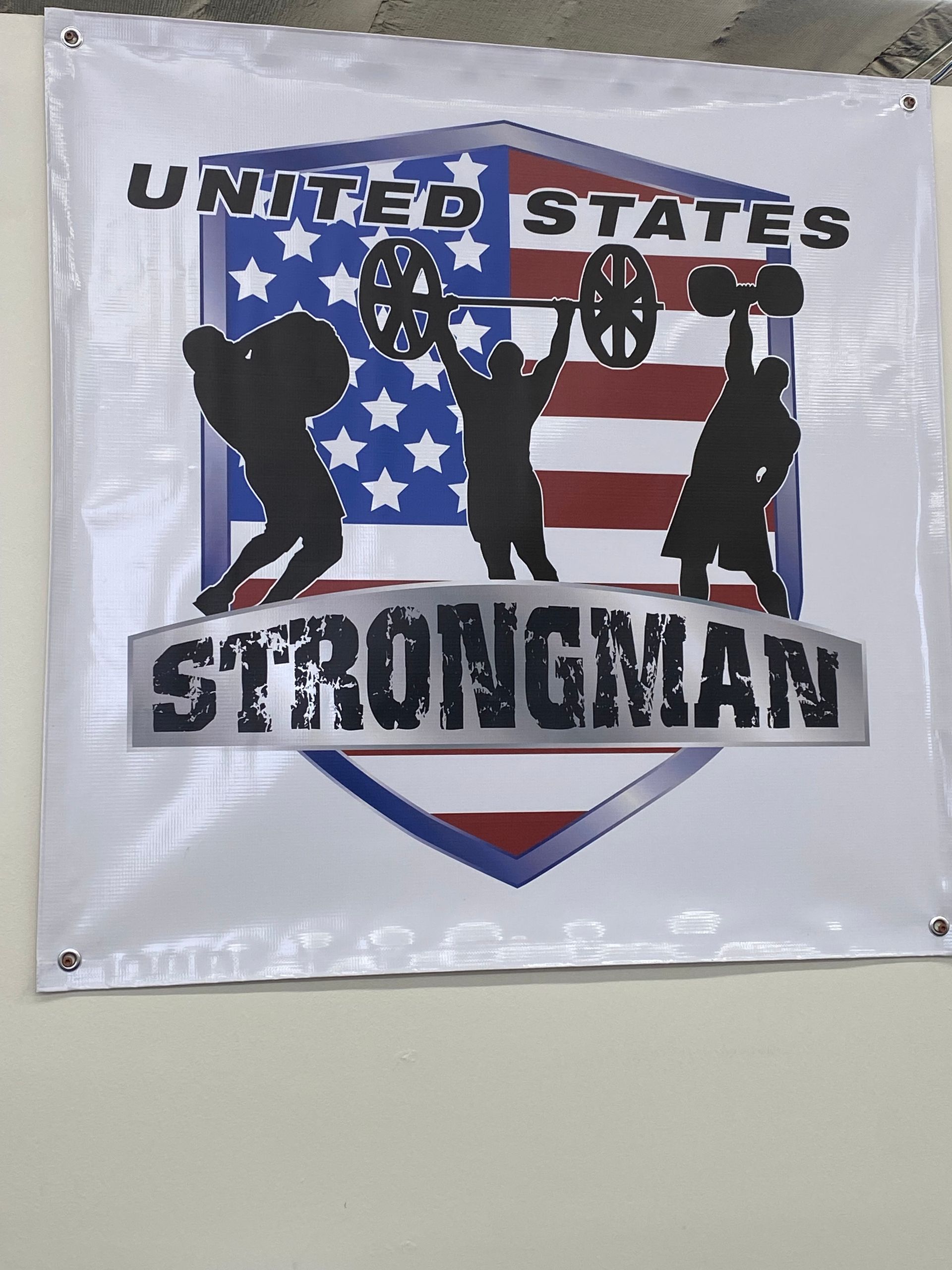 Banner: United States Strongman logo with lifters silhouetted against an American flag design.