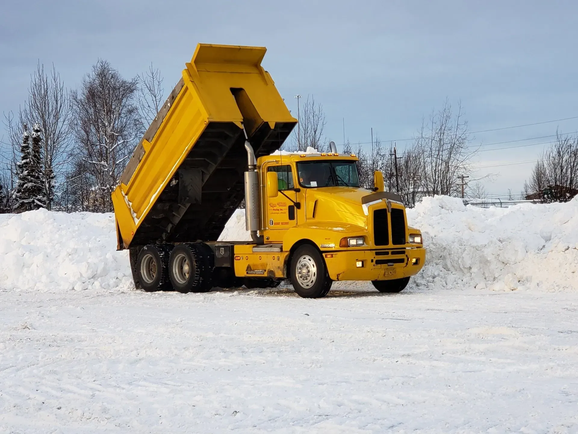 Truck Getting Snow — Anchorage, AK — Ron Webb Paving Inc.