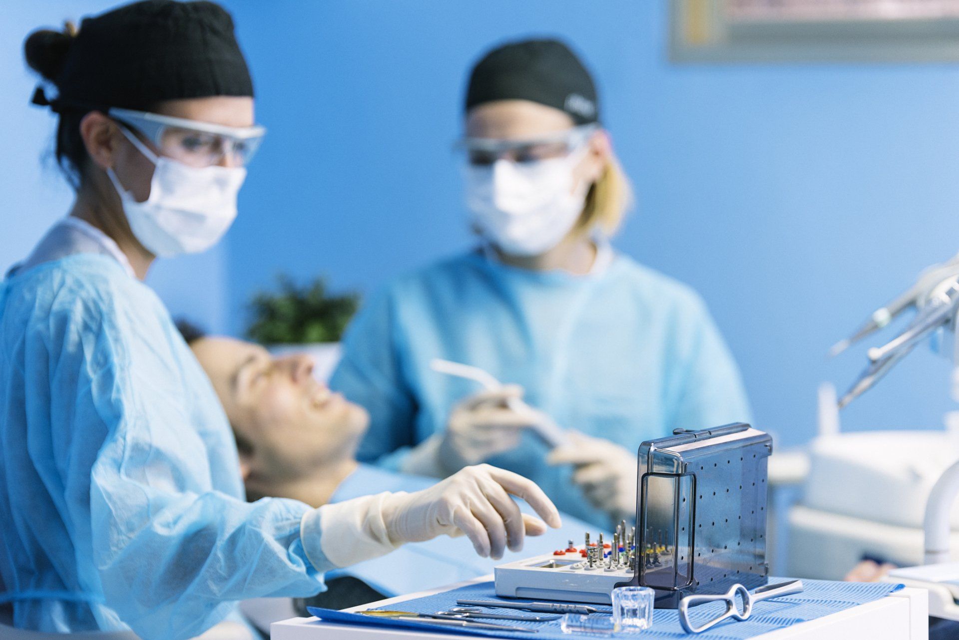 Surgical Dental Services — Dentists with a Patient During a Dental Intervention in Statesville, NC