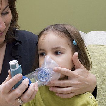 Child using Inhaler Girl Sneezing — DeSoto TX — Allergic Diagnostic & Treatment Clinic