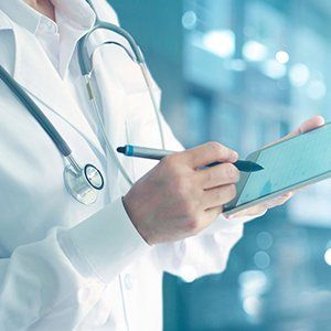 Medicine — Doctor Using Tablet in DeSoto, TX