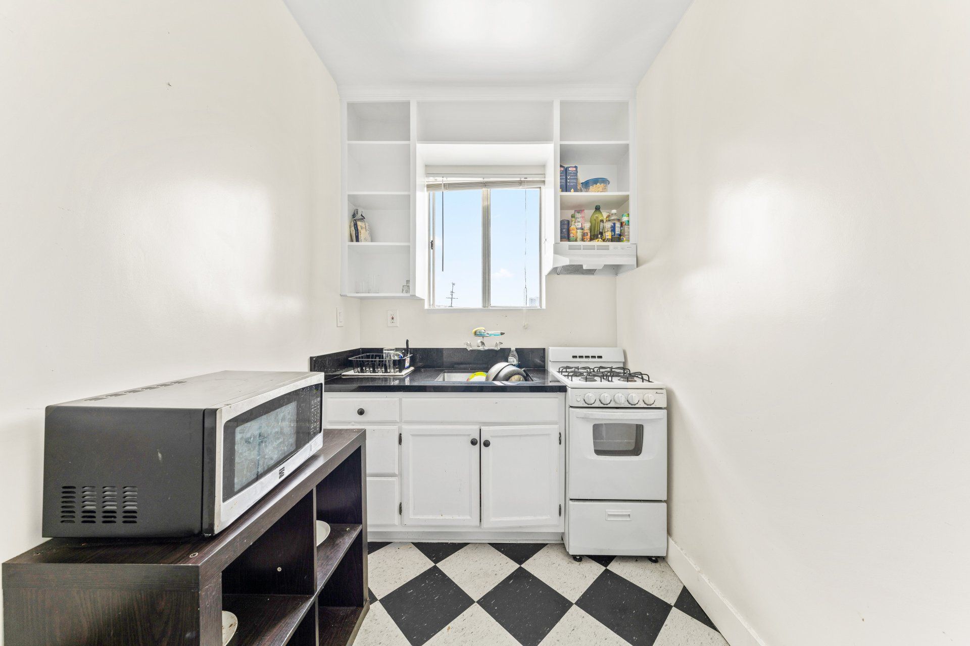 Francis Ave Apartment Kitchen with White Cabinets