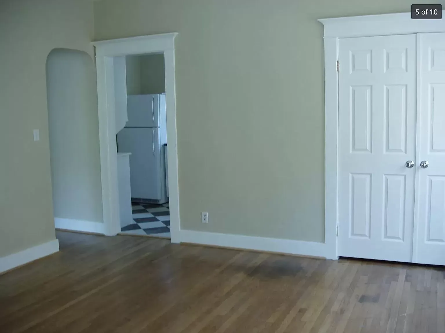 Living Room with Closet and Kitchen Entrance