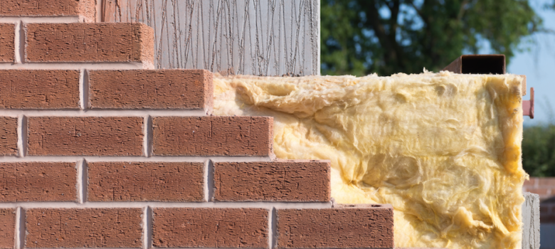 A brick wall with a piece of insulation on it.