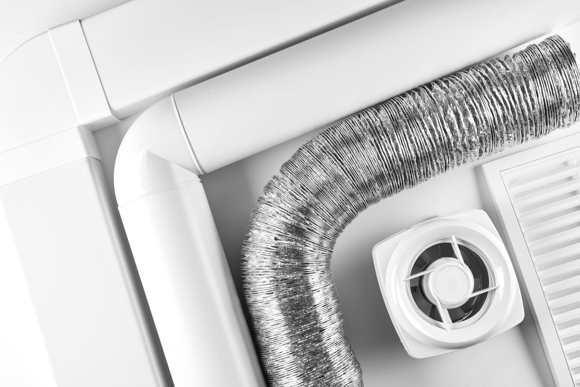 A white box with a fan and a hose attached to it.
