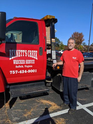 A Man Touching the Bennett's Creek Truck — Suffolk , VA — Bennett's Wrecker Service