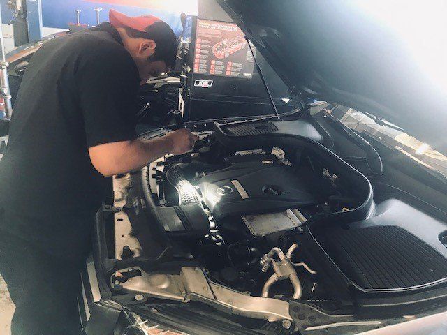 Mechanic Checking the Engine — Lake Forest, CA — V-Tech Automotive