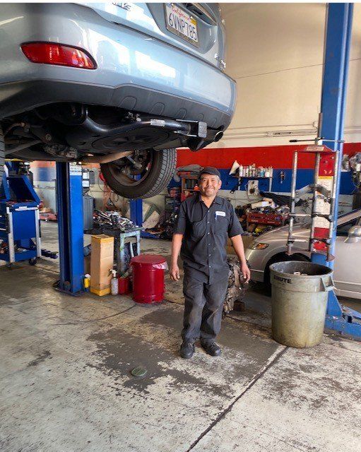 Mechanic Underneath Lifted Car — Lake Forest, CA — V-Tech Automotive