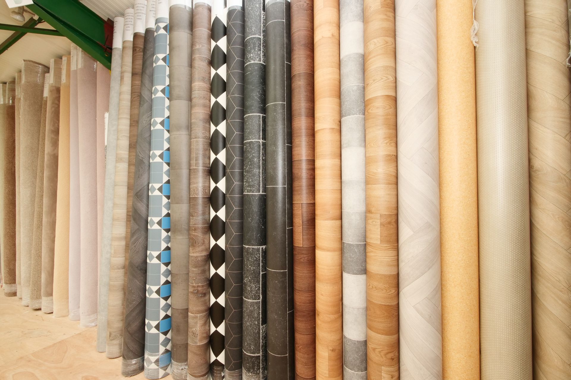 A bunch of rolls of carpet are stacked on top of each other