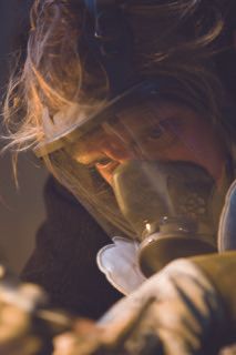 Artist Wearing Gas Mask