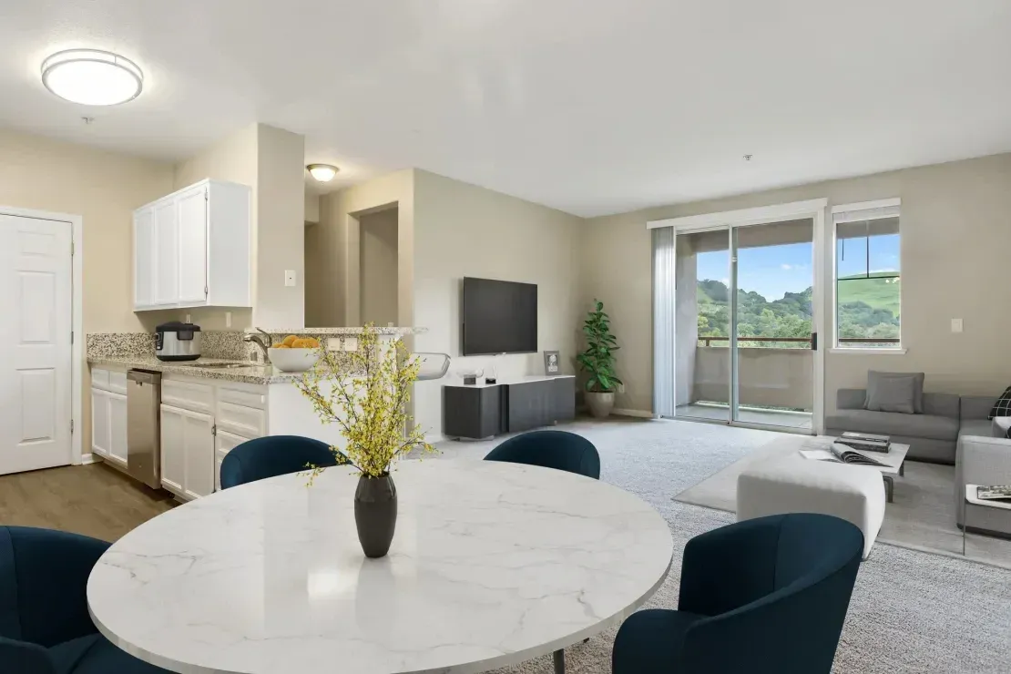 Open-concept living and dining area with a modern kitchen.