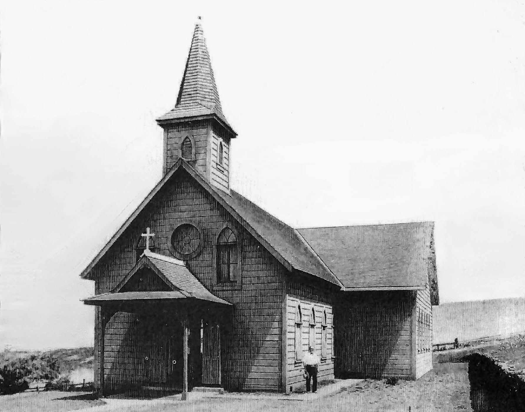 Black and white photo of St. Catherine church with side extension