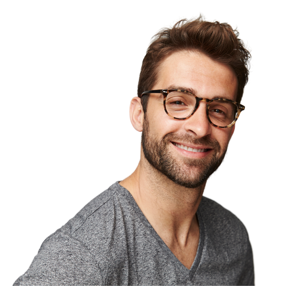 A man wearing glasses and a grey shirt is smiling