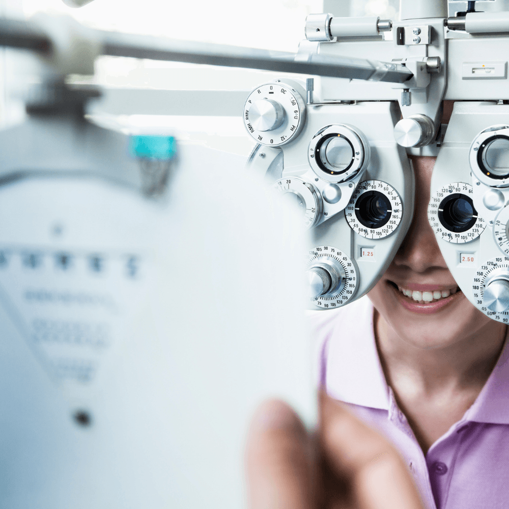 A woman is getting her eyes checked by an ophthalmologist