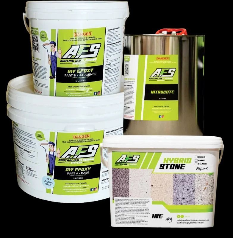 A Person Is Using a Trowel to Spread a White Line on A Concrete Surface — Fraser Coast Waterproofing in Pialba, QLD