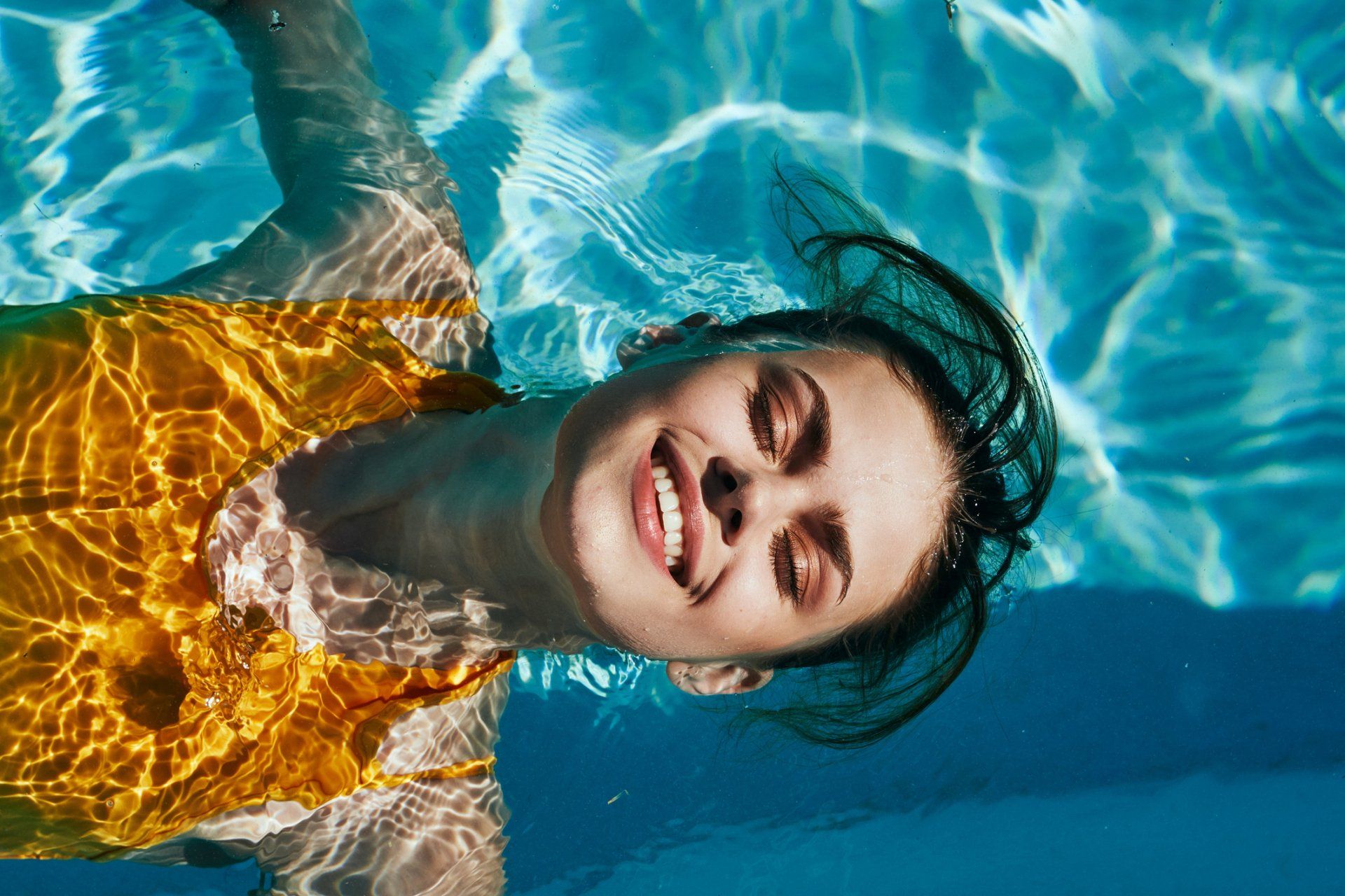 Girl in Yellow Floating in Pool — Hobart, TAS — Hobart Modern Hypnosis