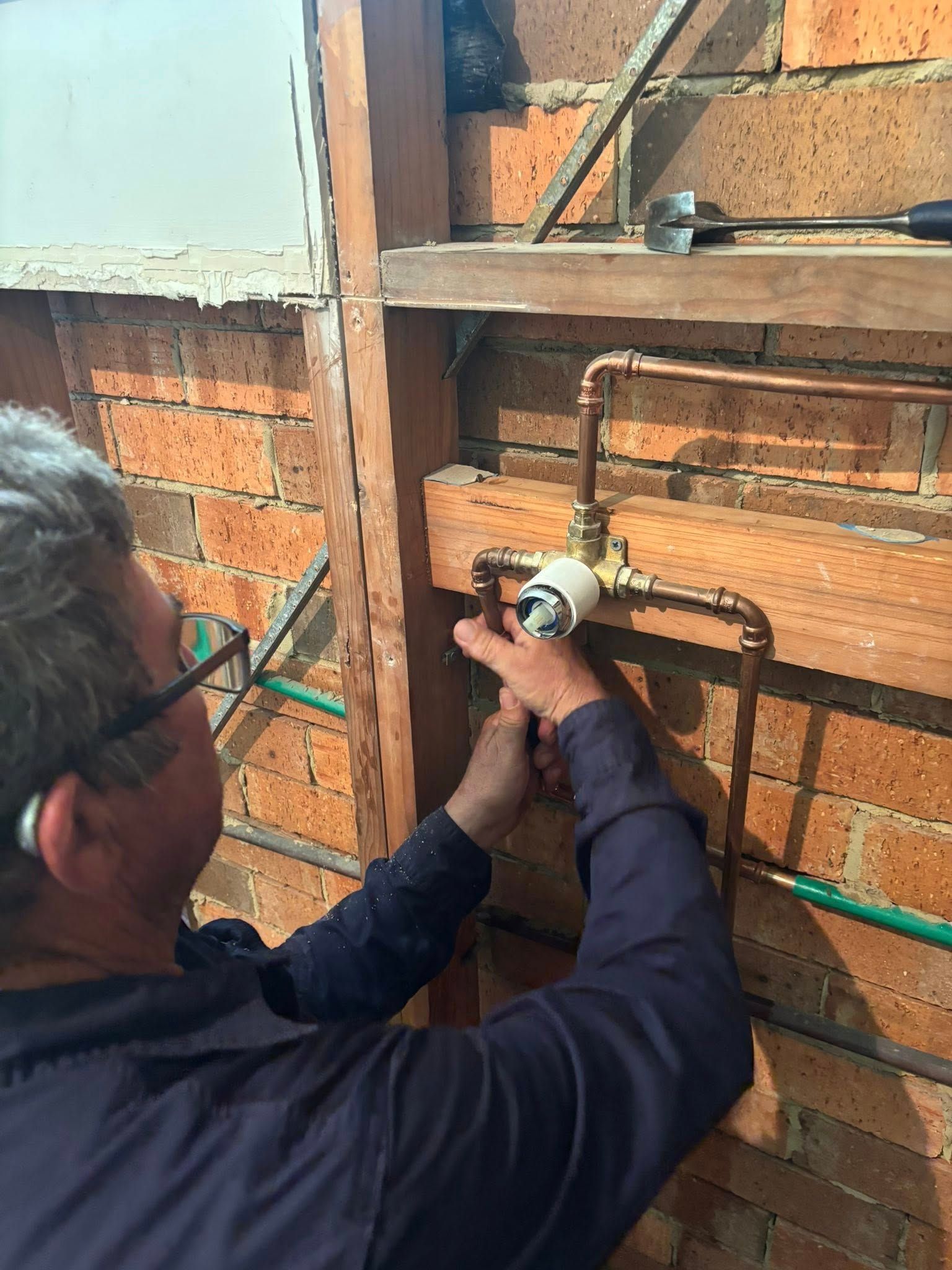 Plumber Working on Copper Pipes — Chris Murphy Plumbing & Maintenance In Langley Vale, NSW