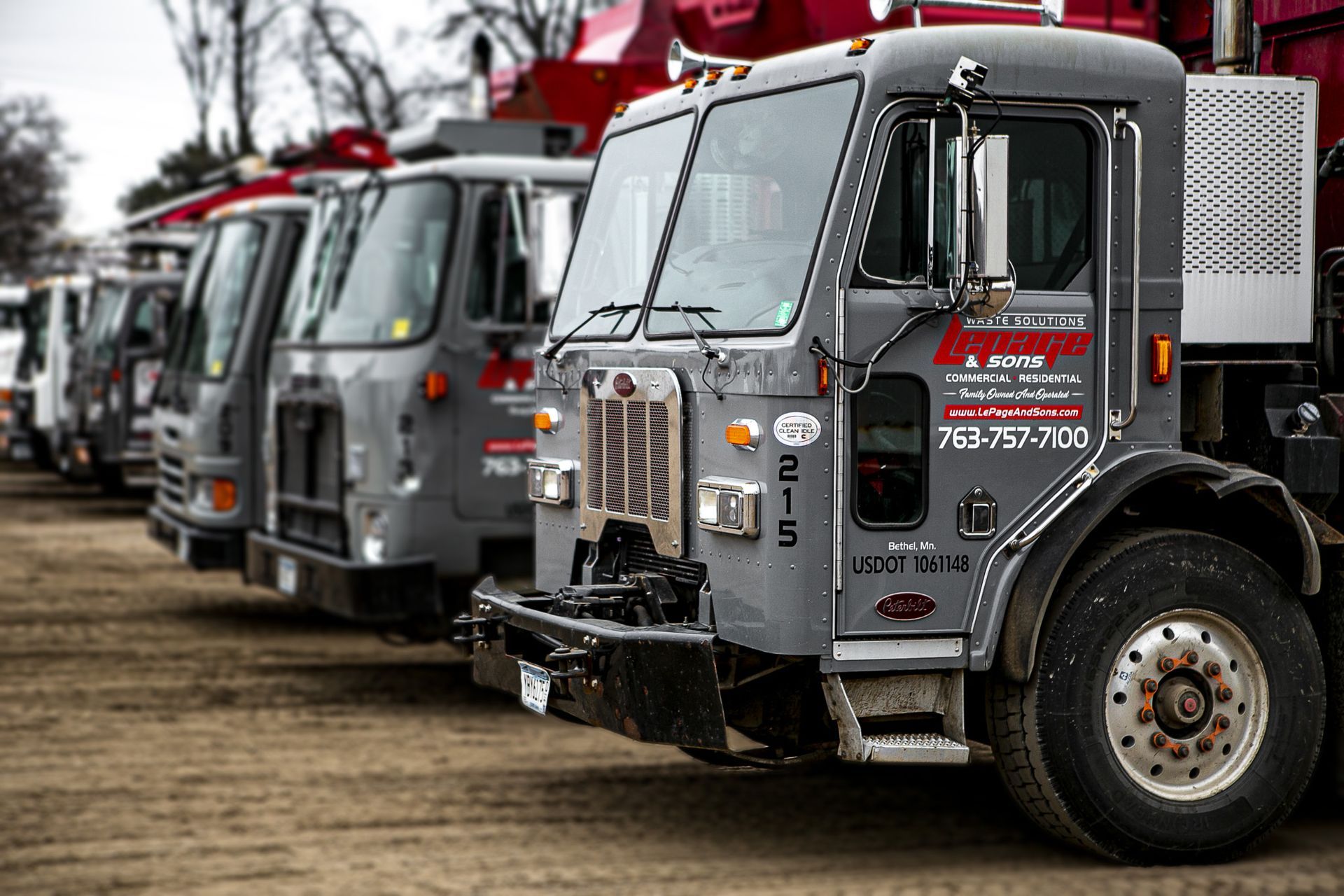 Trucks from LePage & Sons, the best trash company in the north Twin Cities metro, are lined up.