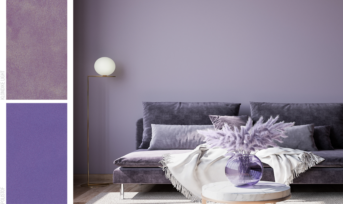 Immagine di una parete dipinta di viola con un divano e un tappeto in tonalità complementari
