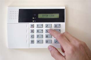 Hand Touching a Security System |Superior Alarm Systems|Upper Darby, PA