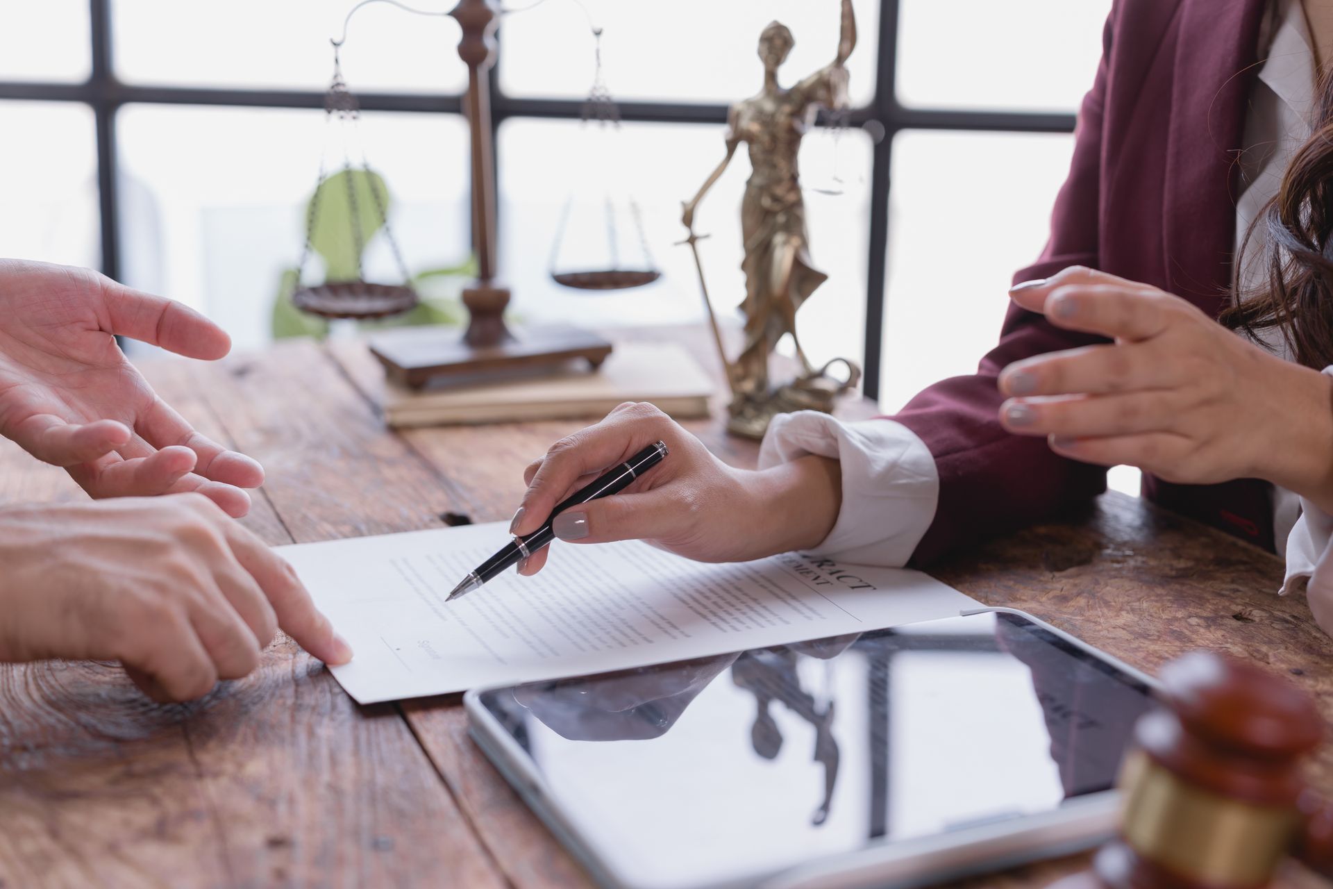 Lawyer explaining a legal document to a client.