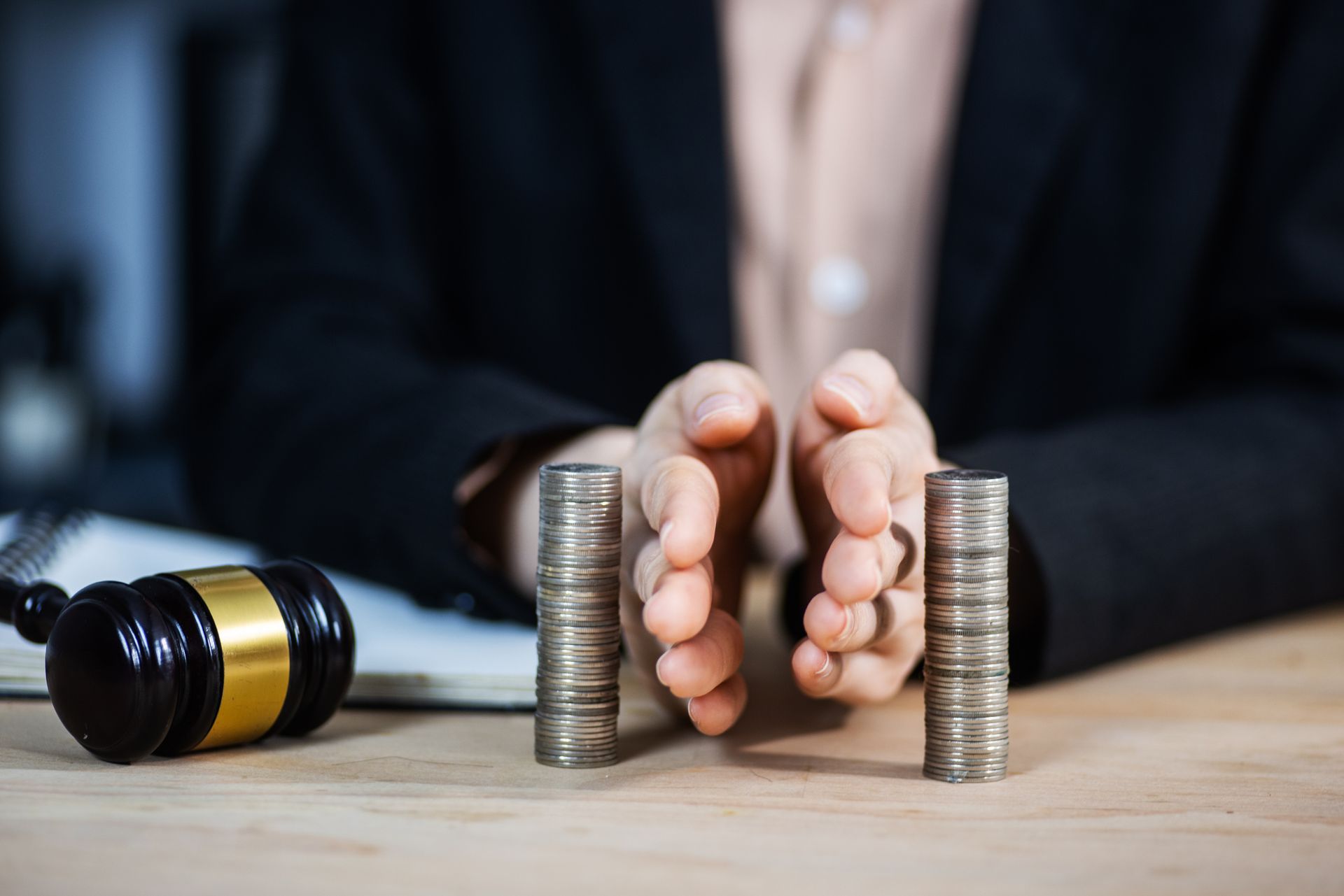 Concept of saving and investing. Businessman separates stack coins.