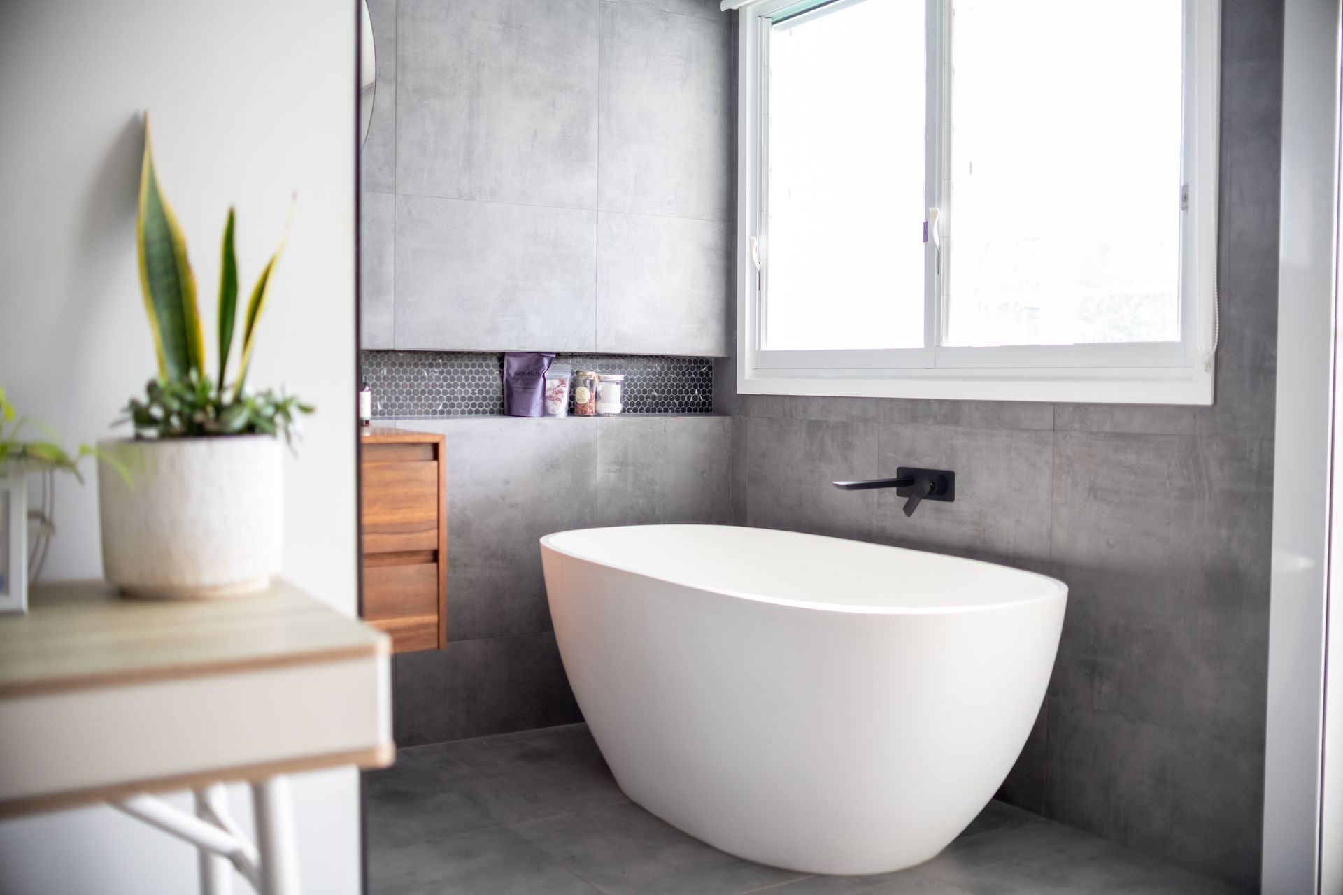 A bathroom with a toilet, sink, and shower.