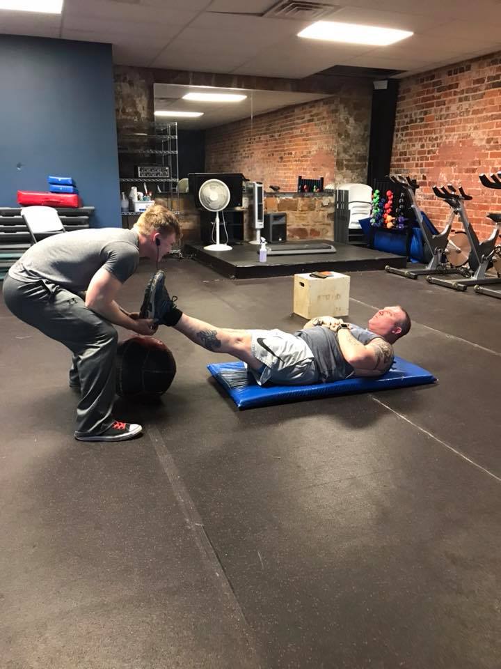 Gym Trainer Helping | Breckenridge, TX | One More Fitness