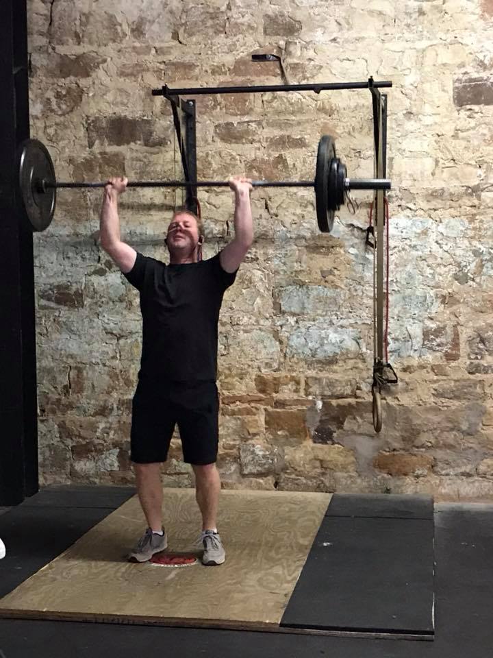 Fitness Man Lifting Dumbbells | Breckenridge, TX | One More Fitness