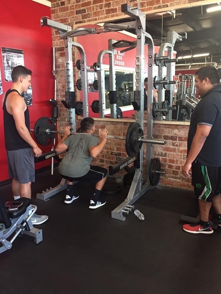 Man Doing Workout Guided by His Trainers — Breckenridge, TX — One More Fitness
