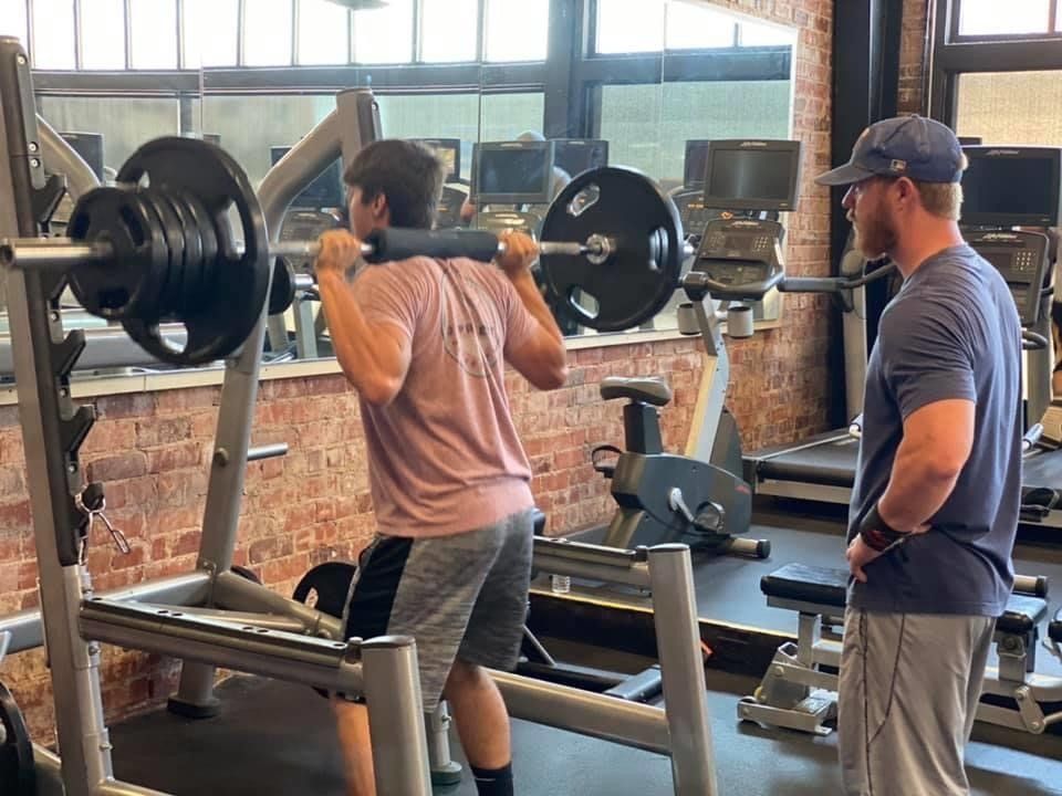 Man Doing Squat Exercise — Breckenridge, TX — One More Fitness