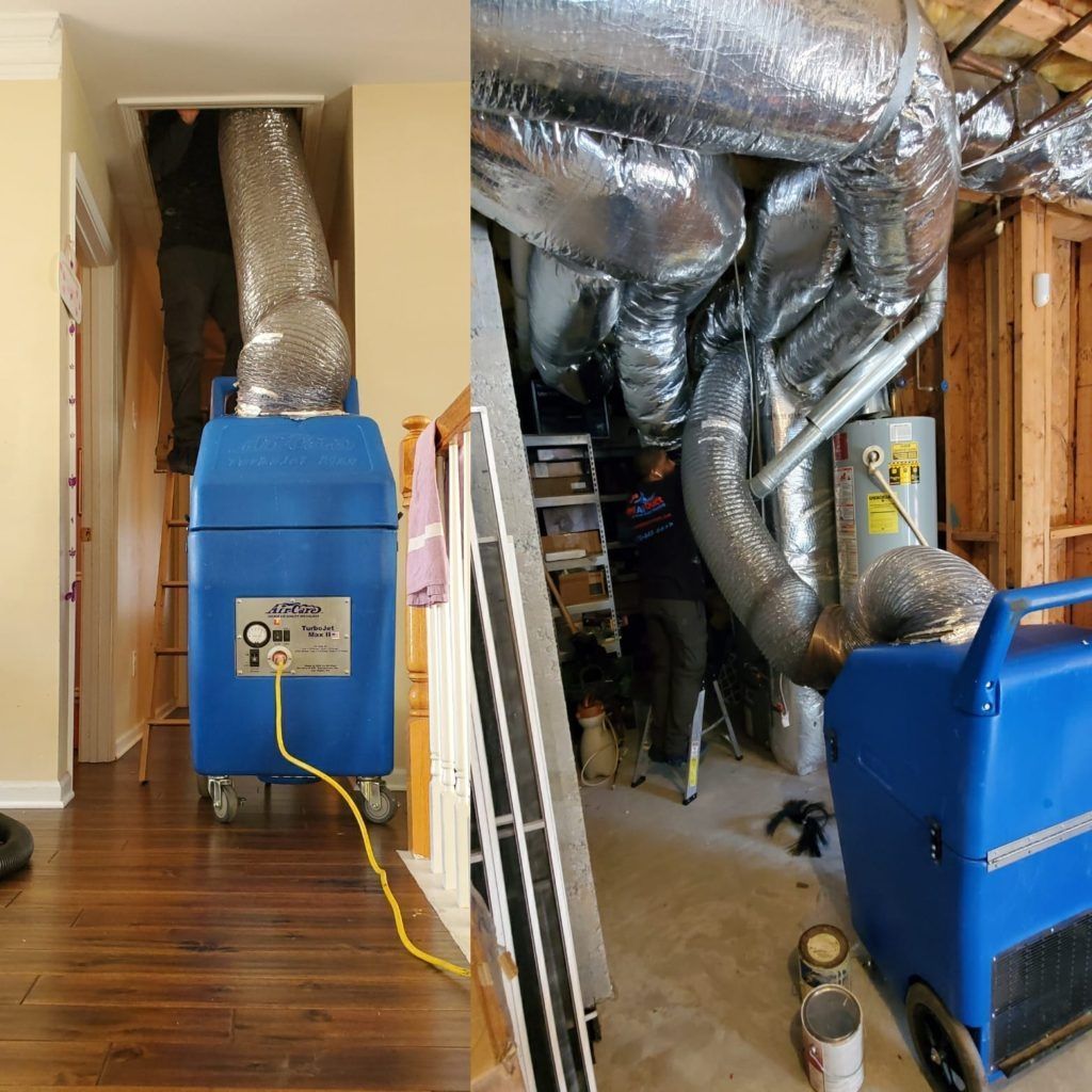 A blue machine is being used to clean ducts in a house