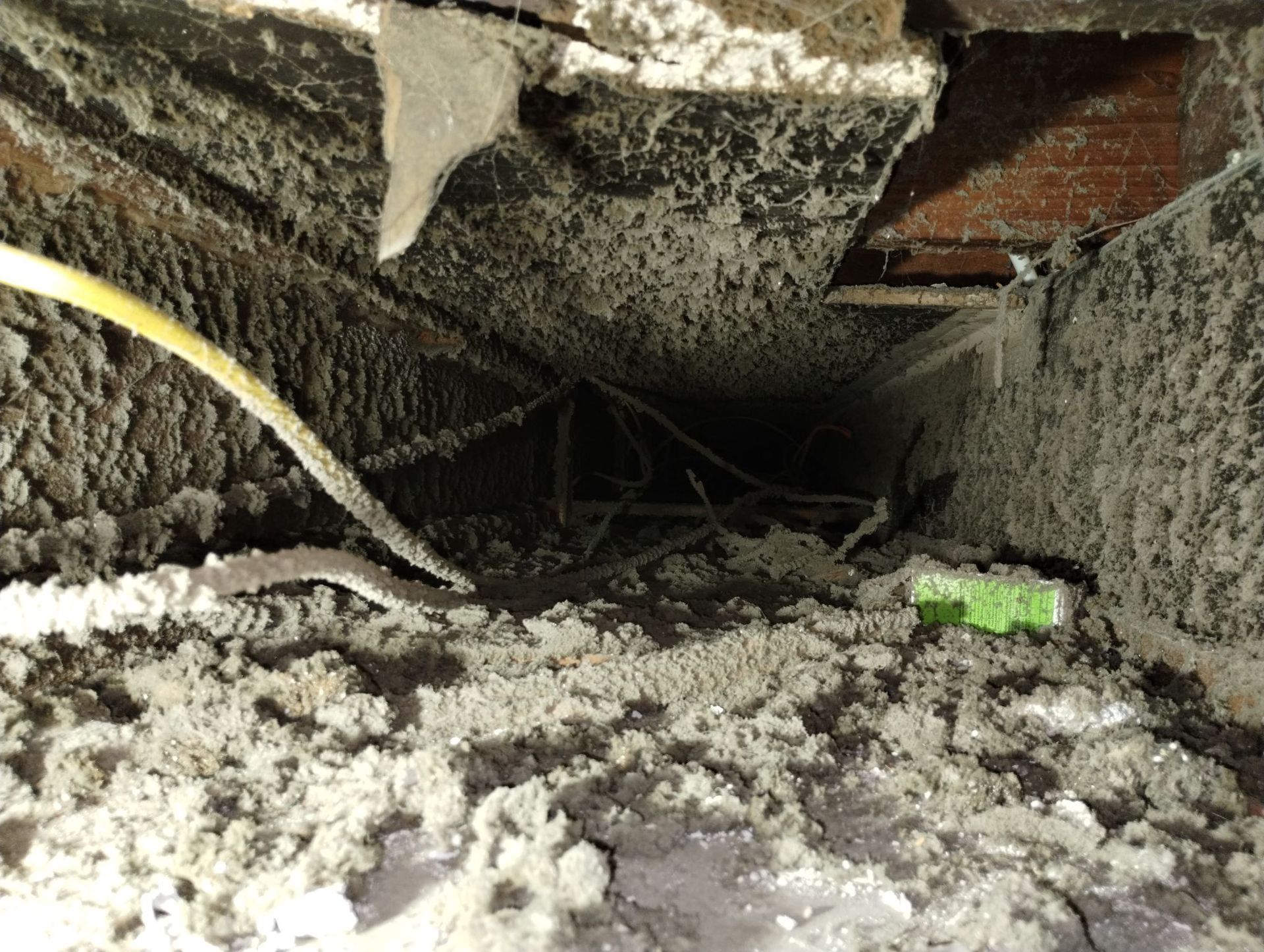 A very dirty room with a lot of dust on the floor