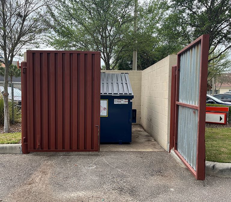 metal decking inside steel frame with locking hooks mounted on steel posts cast in concrete parking lot