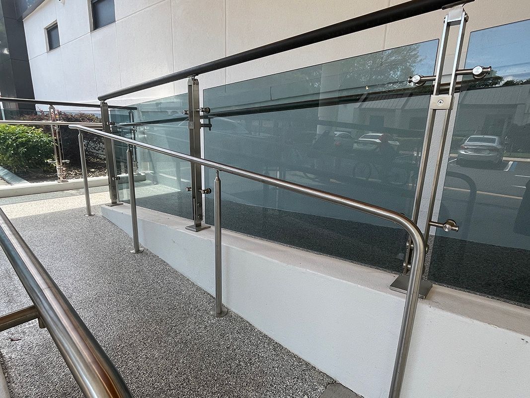commercial building entrance with glass railing system
