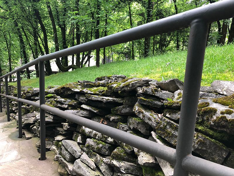 Stylish pipe railing gracefully installed on park stairs