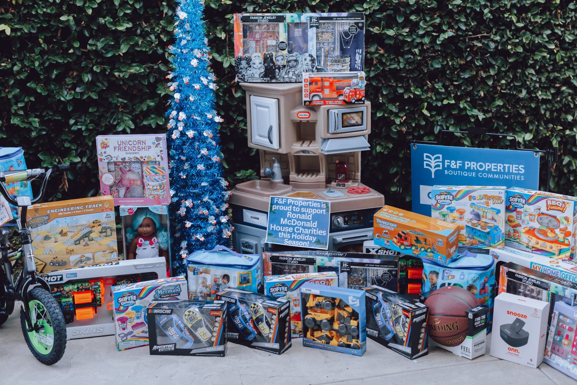 F&F Properties holiday toy drive toys stacked