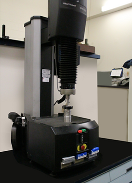 A machine is sitting on a table in a lab.