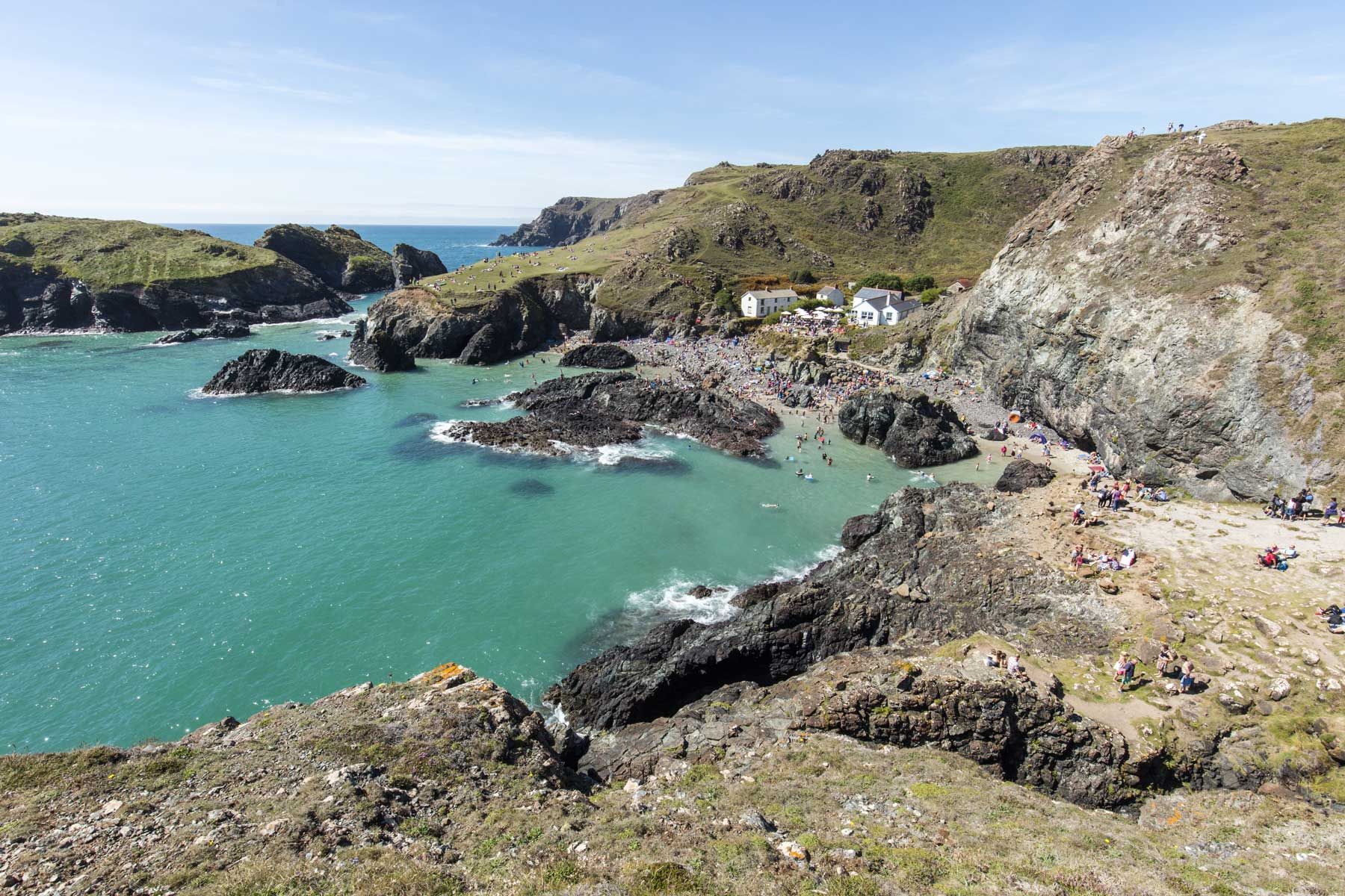 Turquoise waters and cliffs at Kynance Cove on the Lizard Peninsula in Cornwall.
