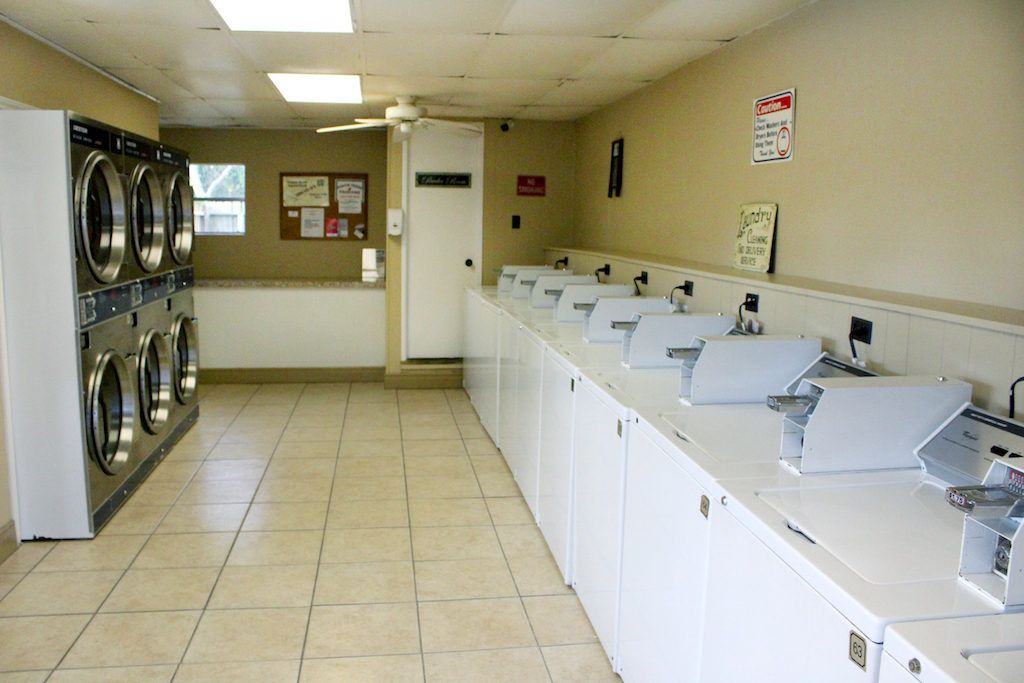A laundromat with a lot of washers and dryers