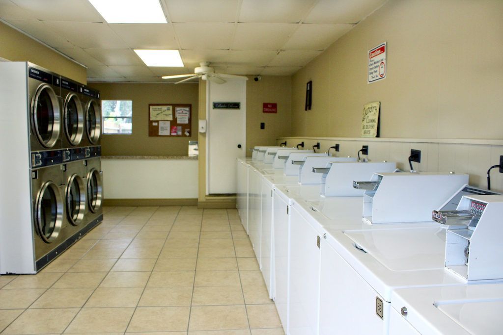 A laundromat with lots of washers and dryers