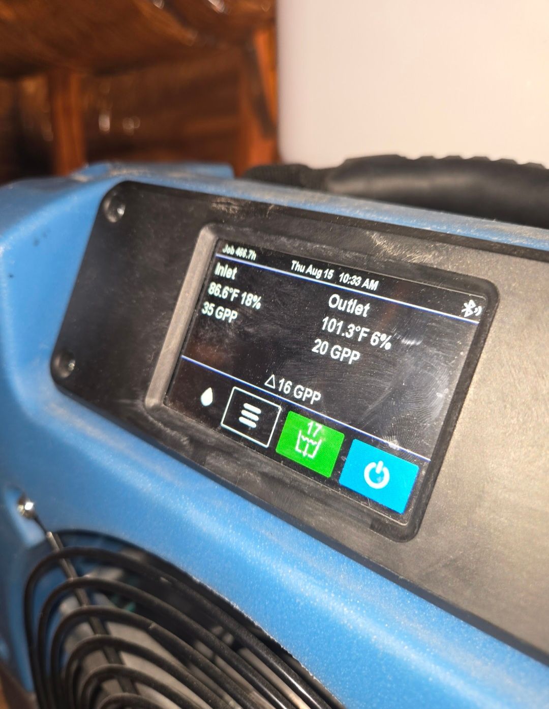 Dehumidifier display showing inlet at 86.9°F, 19%, 35 GPP and outlet at 101.3°F, 6%, 20 GPP.