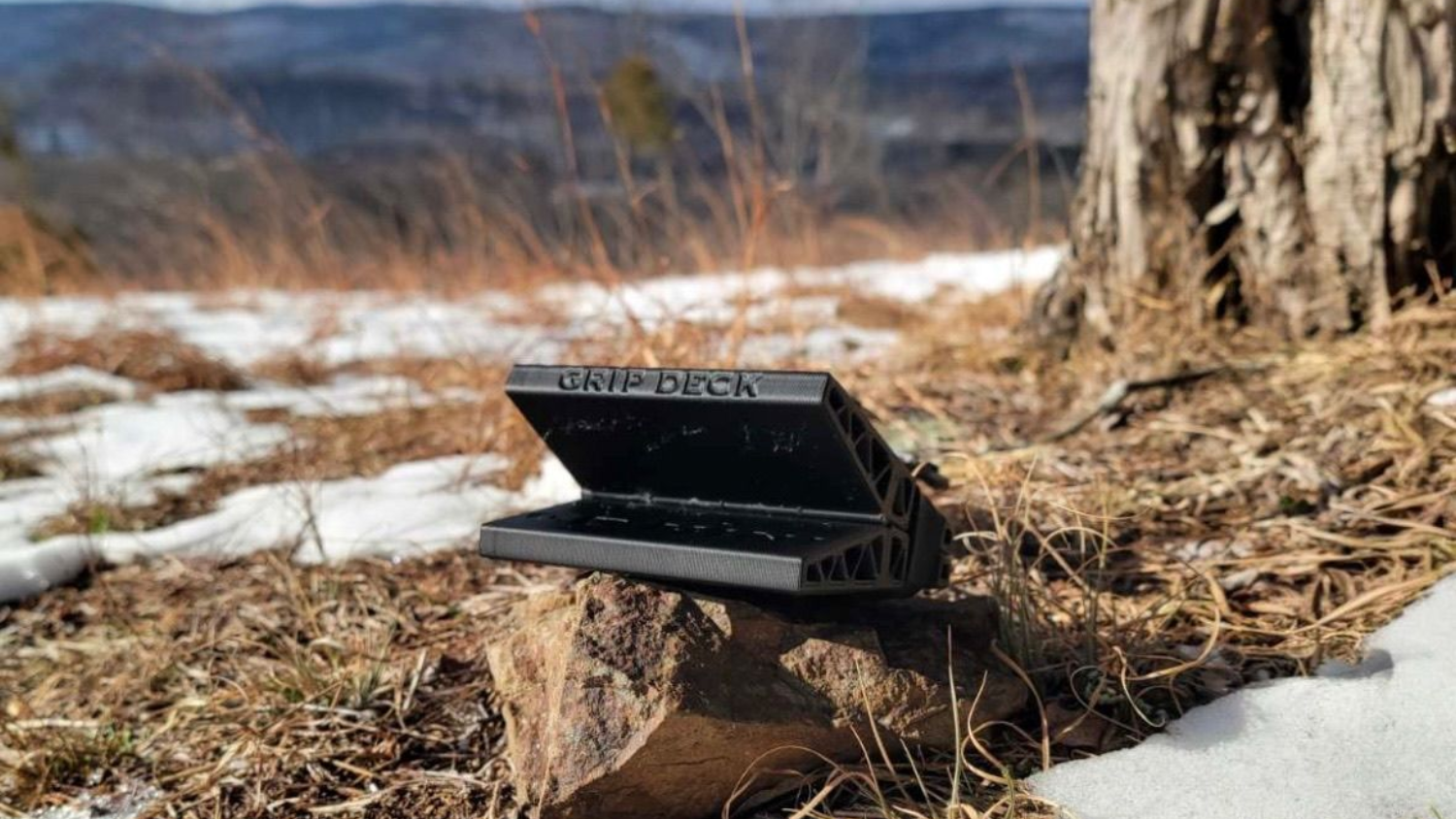 GripDeck black grip tool on snowy ground