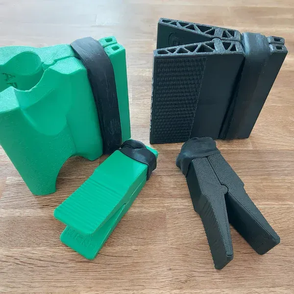 Green and black grip tools on table