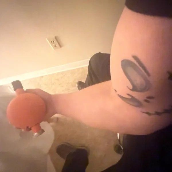 Man holding orange 3D-printed orange