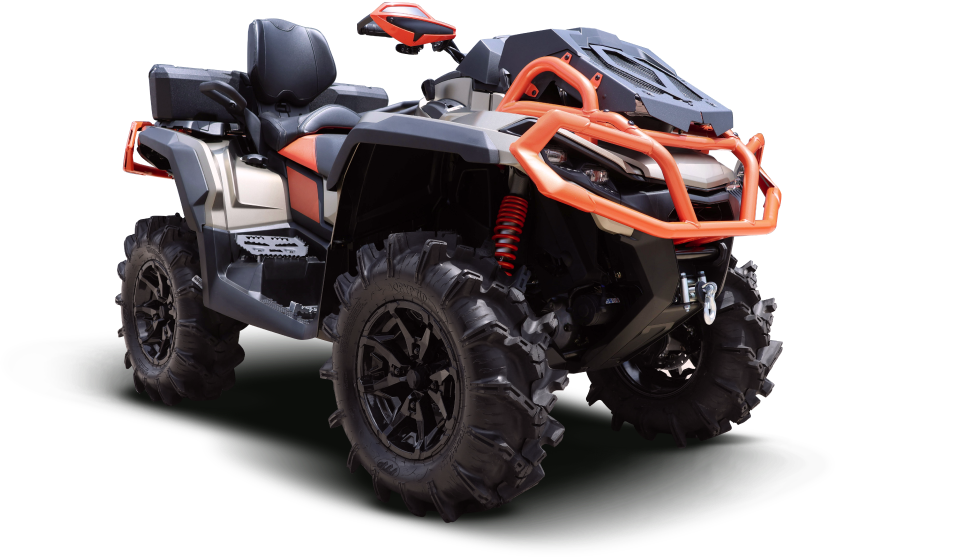 Black and orange all-terrain vehicle with large, rugged tires, parked on a white surface | Dean's Auto Body