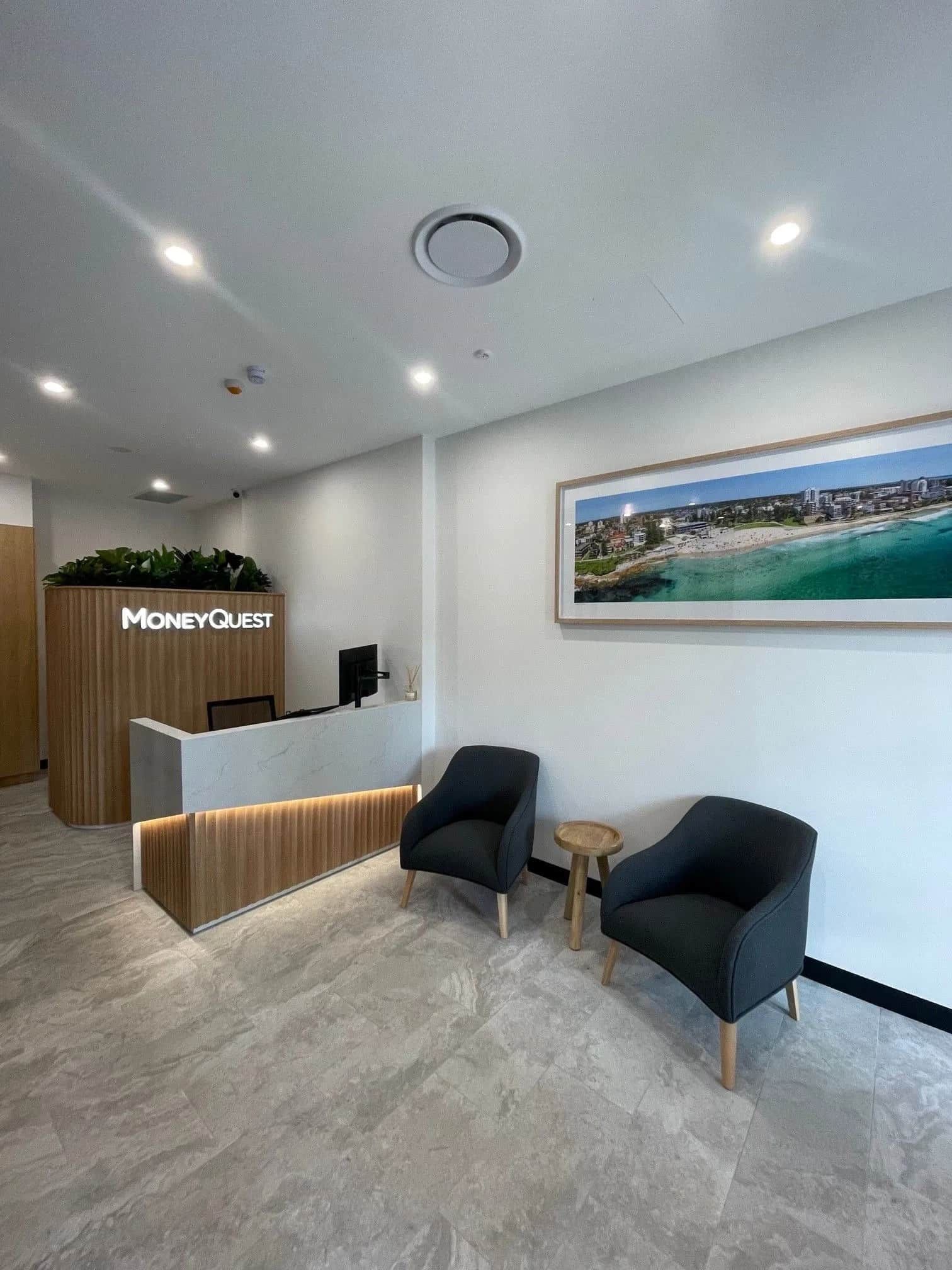 Modern Office Reception Area With a Desk, Seating, and a Framed Seascape — ATH Projects in Kirrawee, NSW