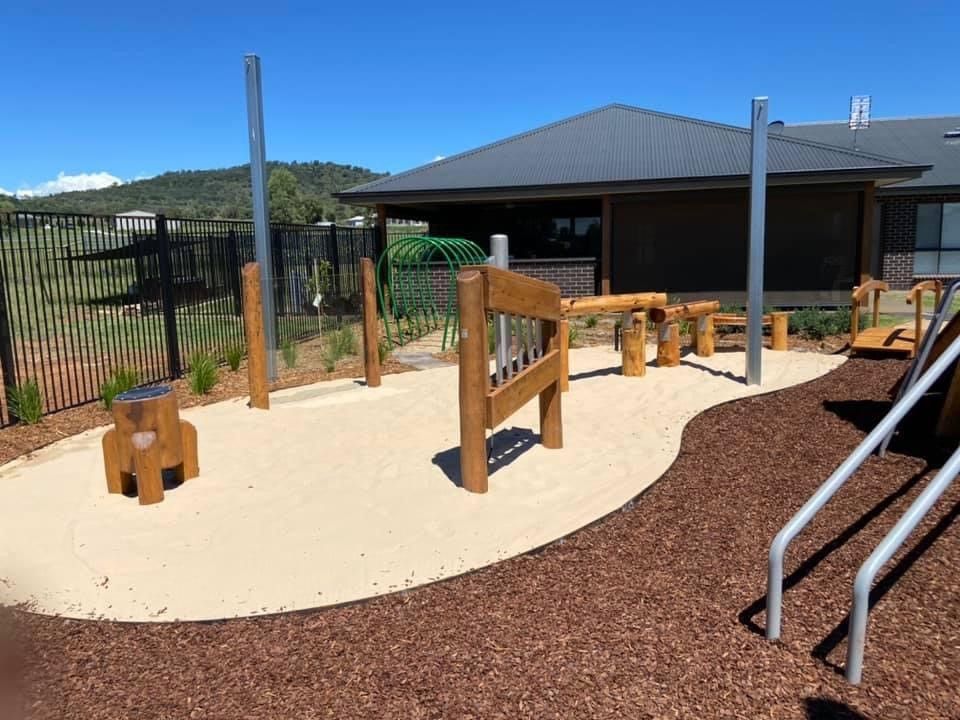 Playground with wooden structures — ATH Projects in Moore Creek, NSW